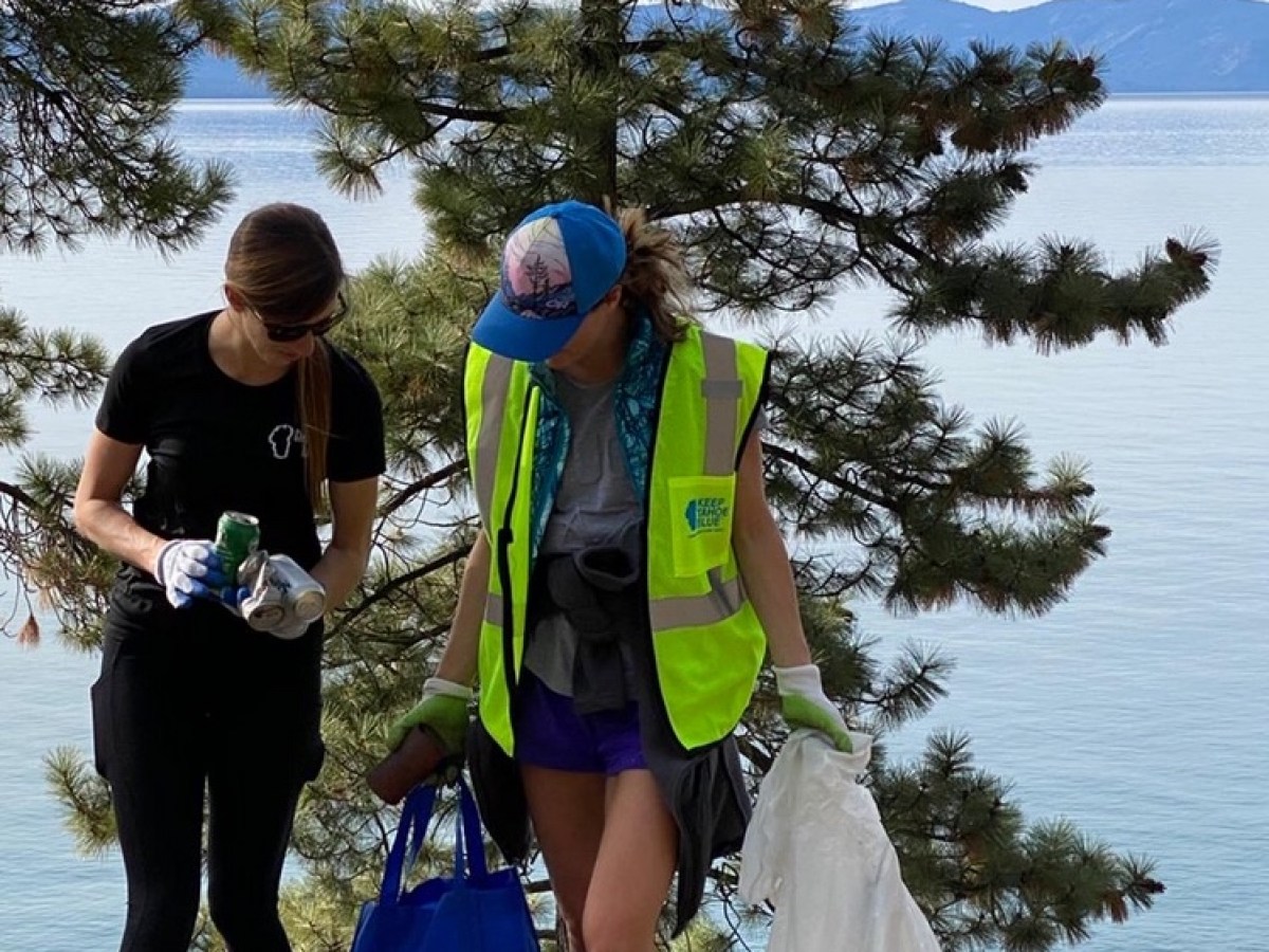 a couple of people that are standing in the water