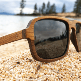 a close up of a bench in front of a mirror