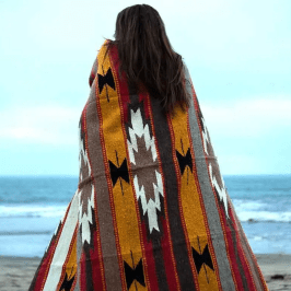 a person standing in front of a body of water