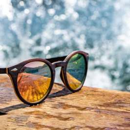 a close up of a bench in front of a mirror