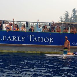 a group of people riding on the back of a boat
