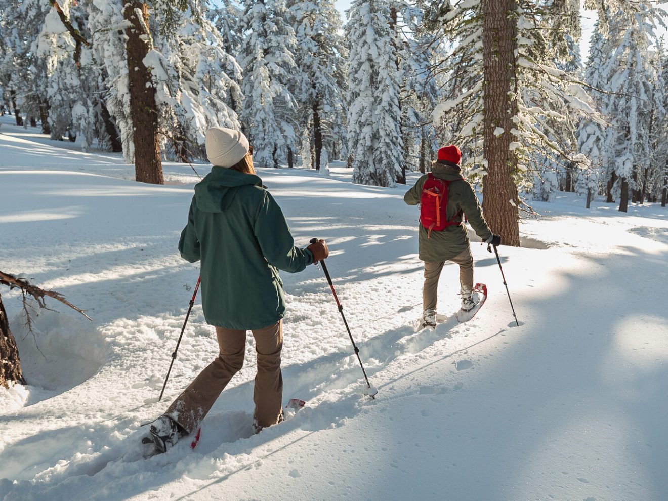 a man is cross country skiing on a snow covered slope
