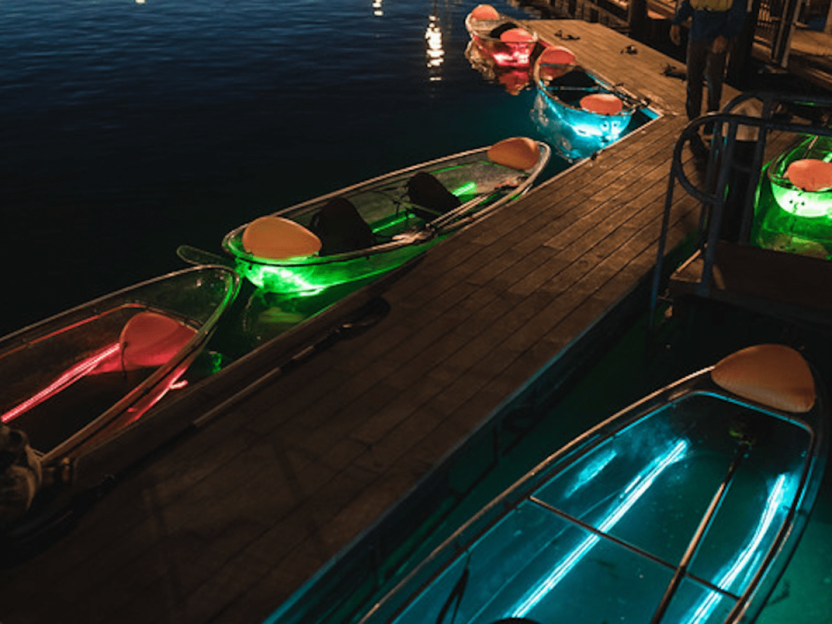 a boat is docked next to a body of water