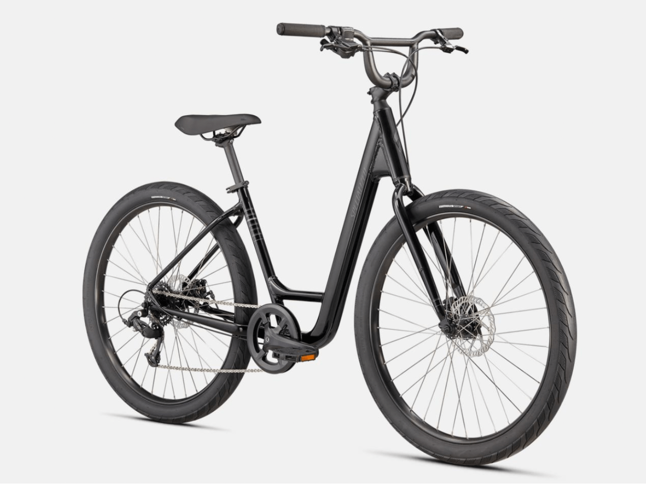 a bicycle leaning against a wall