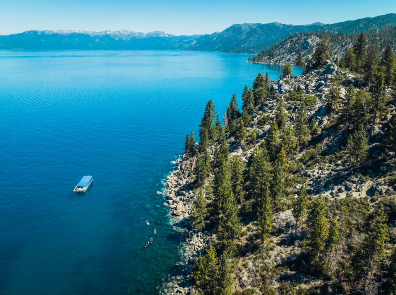 a body of water with a mountain in the background