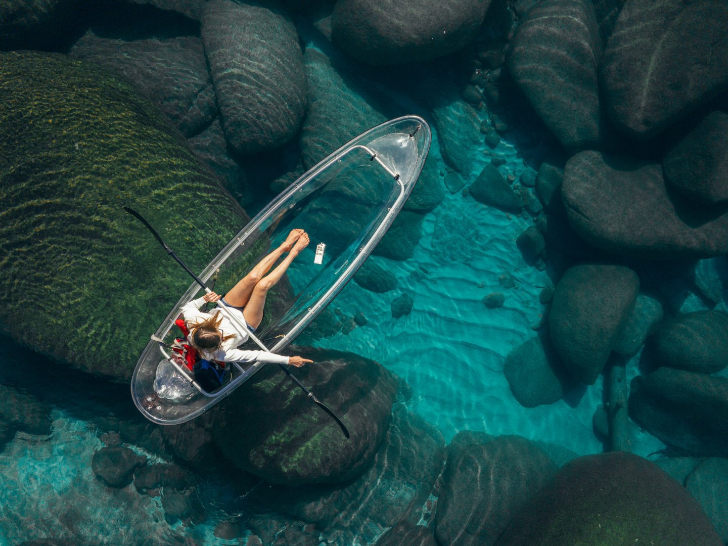 a teddy bear sitting in the water