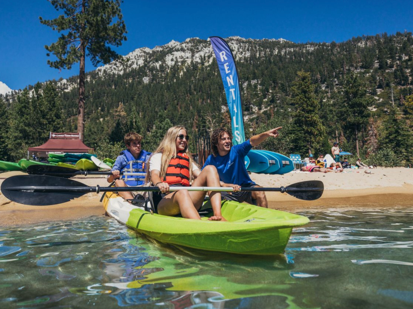 a person riding on the back of a boat in the water