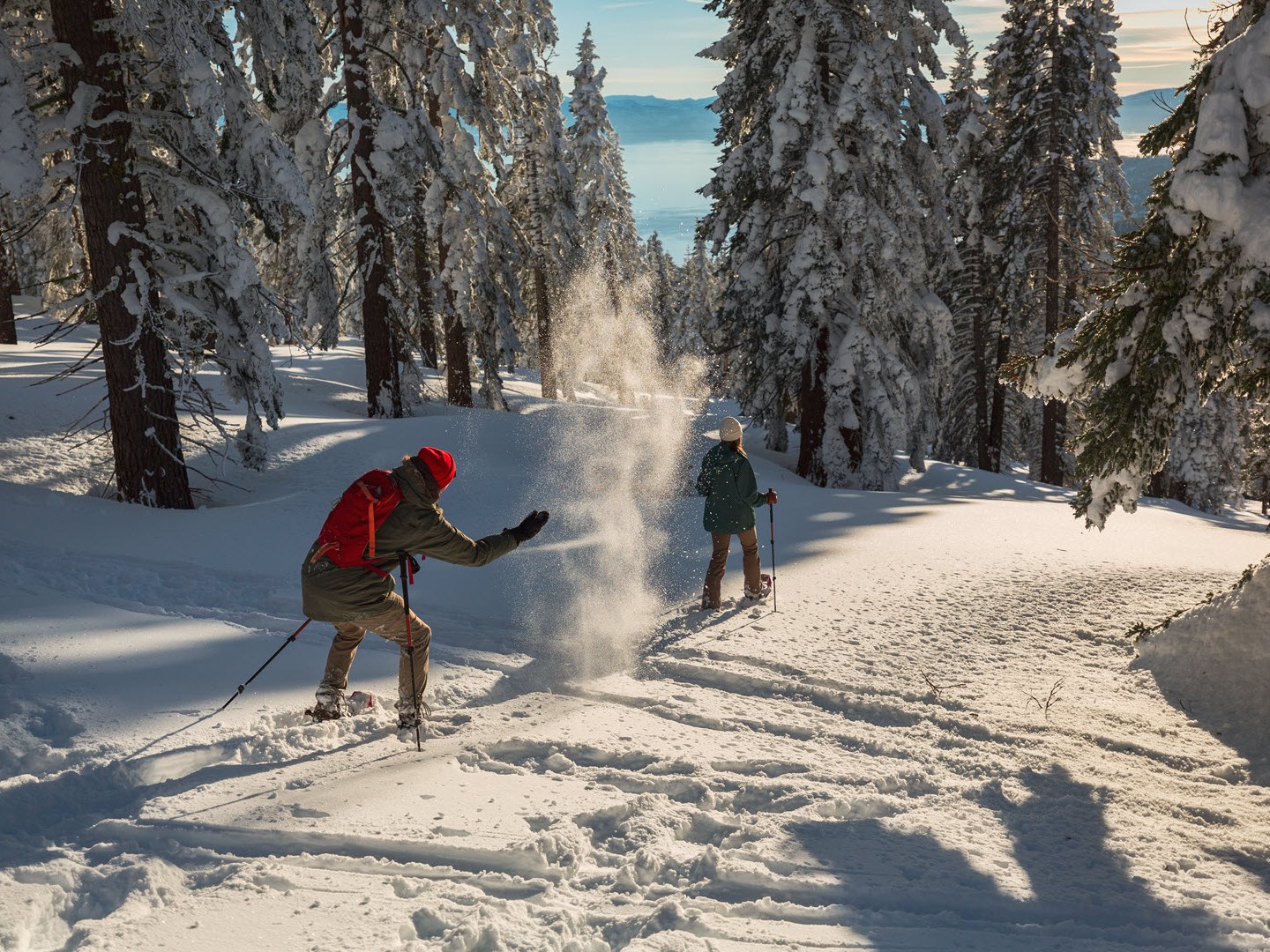 a man riding skis down a snow covered slope