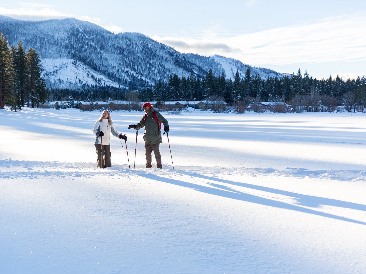 a group of people cross country skiing in the snow