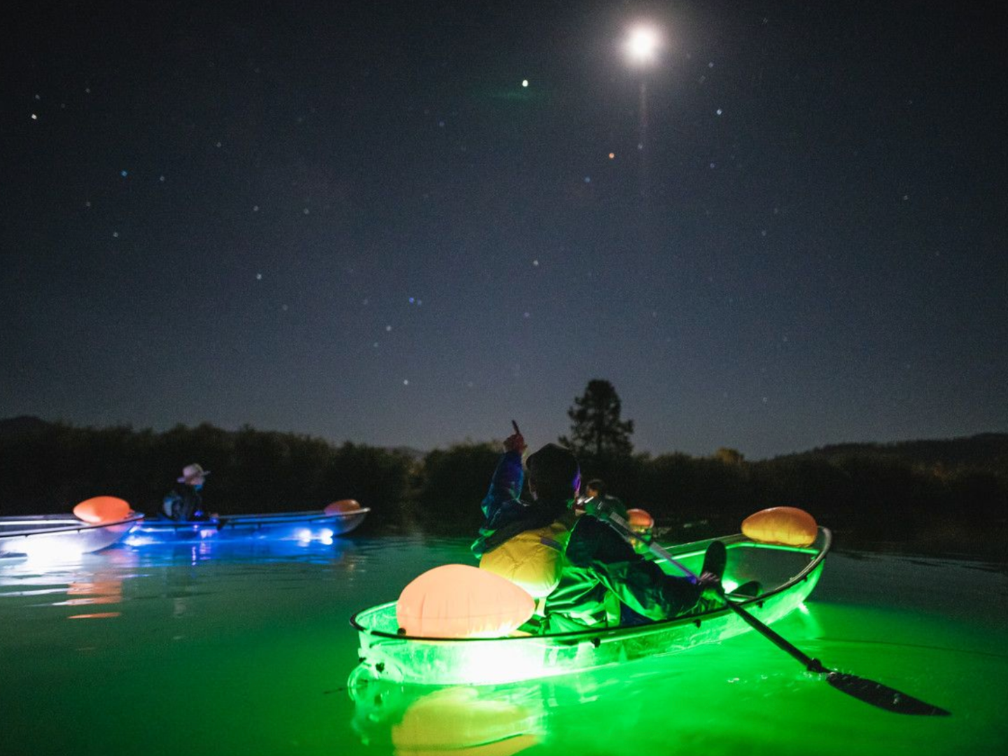 a group of people on a boat in the water