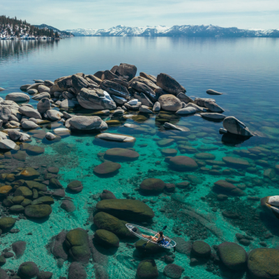 a rocky shore next to a body of water