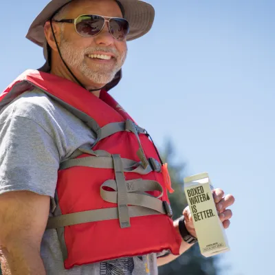 a man wearing a hat and sunglasses